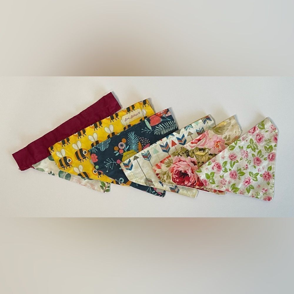 Good used condition. 6 dog bandanas with slit for collar for small dogs.